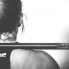 Lifter with a barbell across her back