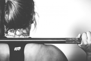Lifter with a barbell across her back