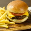 Burger and fries on a board