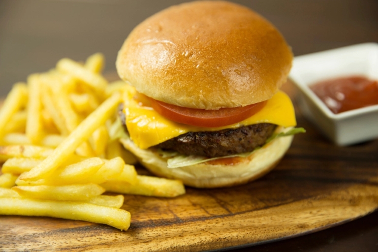 Burger and fries on a board
