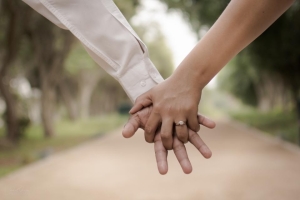 Couple holding hands on a walk