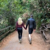 Couple walking together on a forest trail