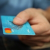 Hand holding a credit card