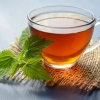 Cup of tea with fresh mint leaves