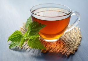 Cup of tea with fresh mint leaves