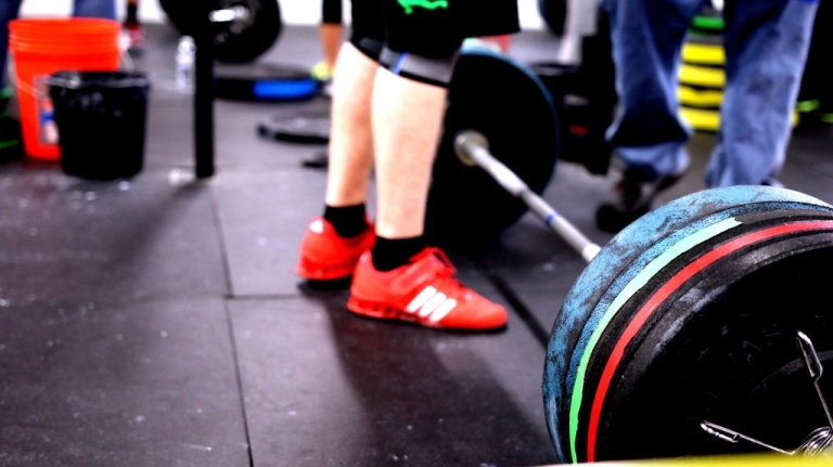 Lifter setting up a heavy deadlift