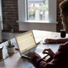 Man working at a desk with a laptop