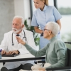Doctor and nurse meeting with a patient