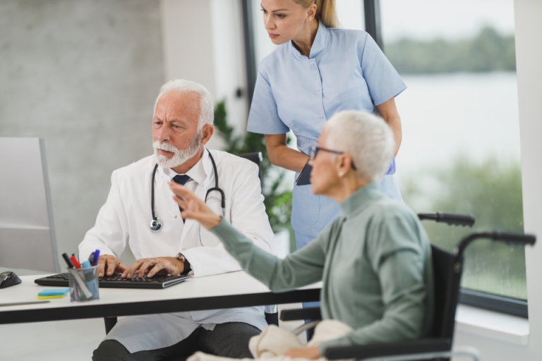 Doctor and nurse meeting with a patient