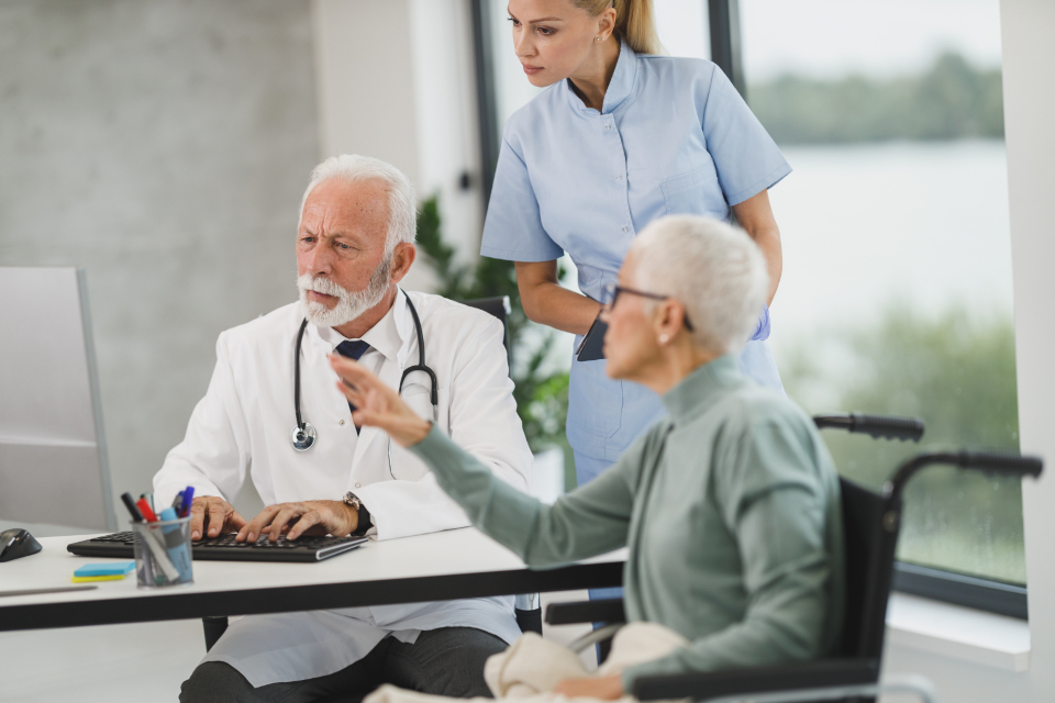 Doctor and nurse meeting with a patient