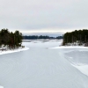 Frozen lake with snow-covered shoreline