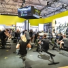 Group fitness class in a busy gym