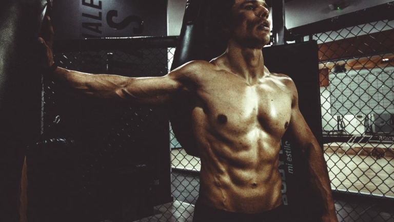 Lean, muscular man in a gym