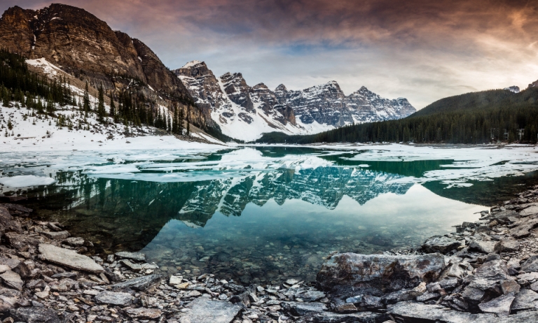 Cold mountain lake surrounded by peaks