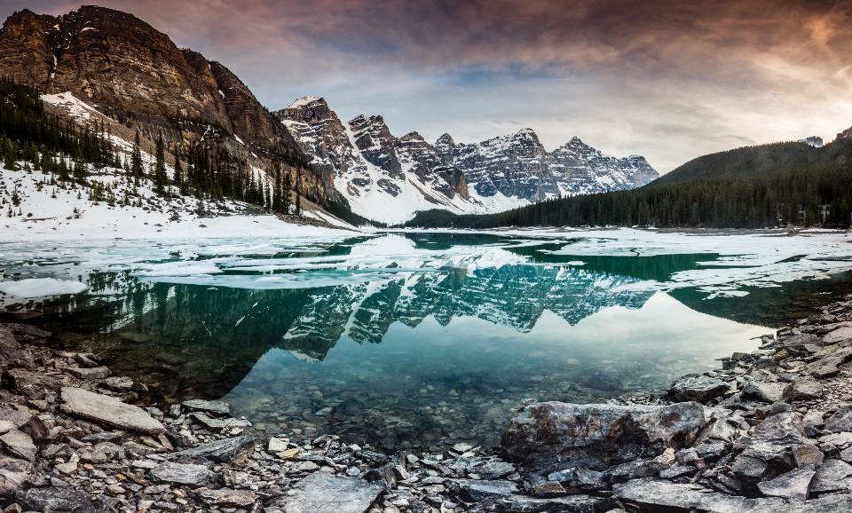 Cold mountain lake surrounded by peaks