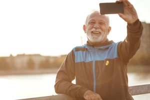 Smiling older man outdoors after exercise