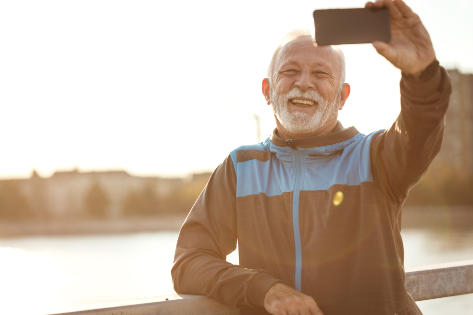 Smiling older man outdoors after exercise