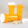 Pill bottles and tablets on a white table
