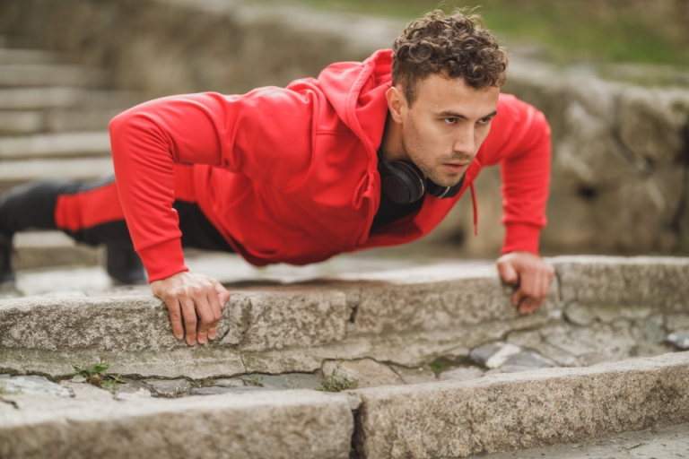 Man doing push-ups outdoors