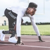 Athlete in the starting position on a running track
