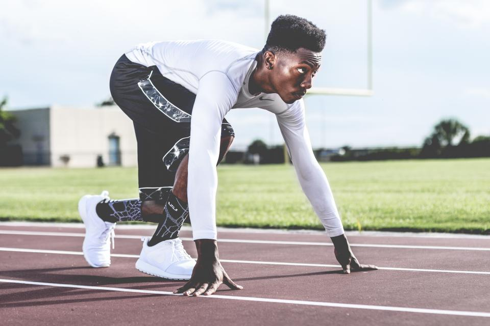 Athlete in the starting position on a running track