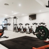 Gym with a squat rack and bikes