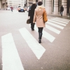 Person walking across a city crosswalk