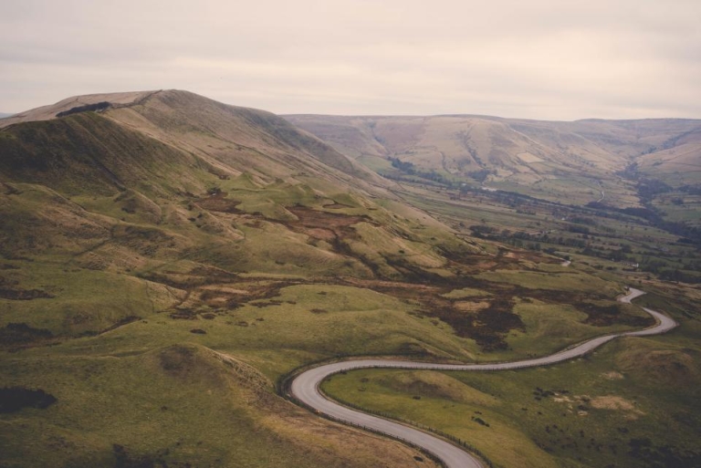 Winding road through green hills