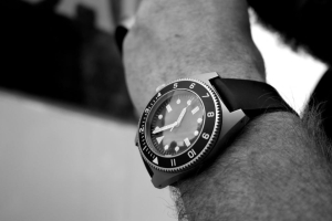 Wristwatch on an arm, keeping a regular schedule
